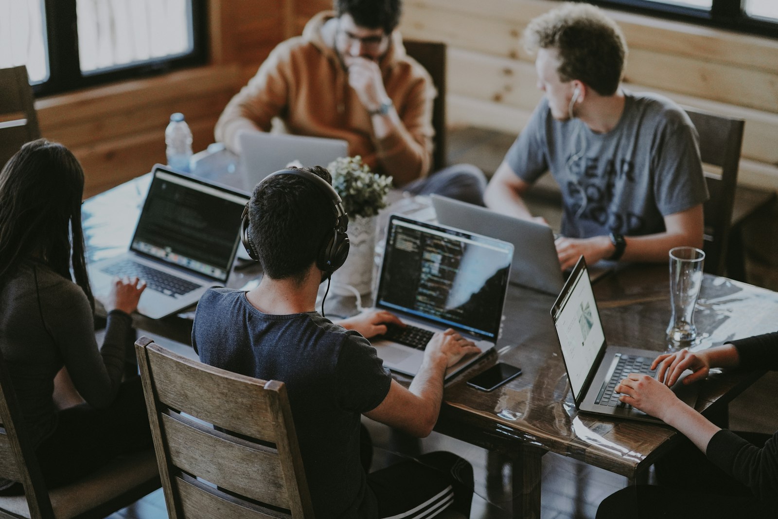 Growing team collaborating across a modern US office workspace
